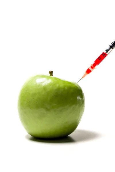 Green apple with syringe — Stock Photo, Image