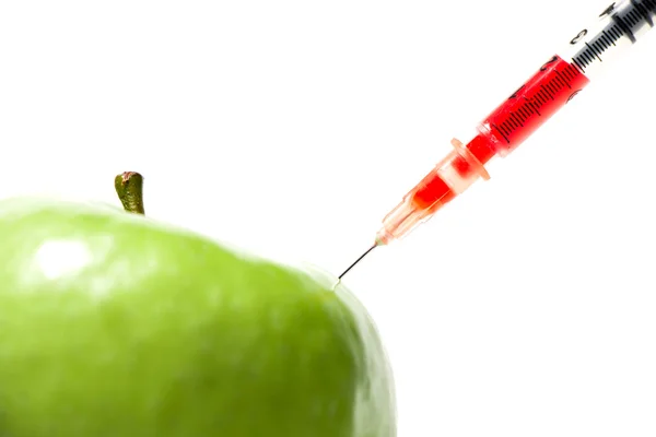 Green apple with syringe — Stock Photo, Image