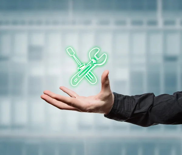 Businessman holding a virtual tool — Stock Photo, Image