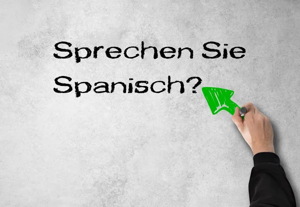 Ember írja, beszél spanyolul, a falon — Stock Fotó