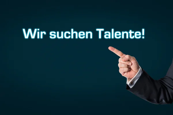 Ділова людина вказує на слова Ми шукаємо співробітників — стокове фото