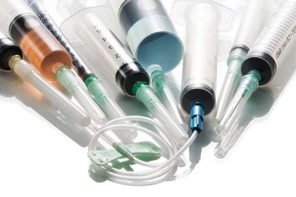 Various syringes filled with colored liquids — Stock Photo, Image