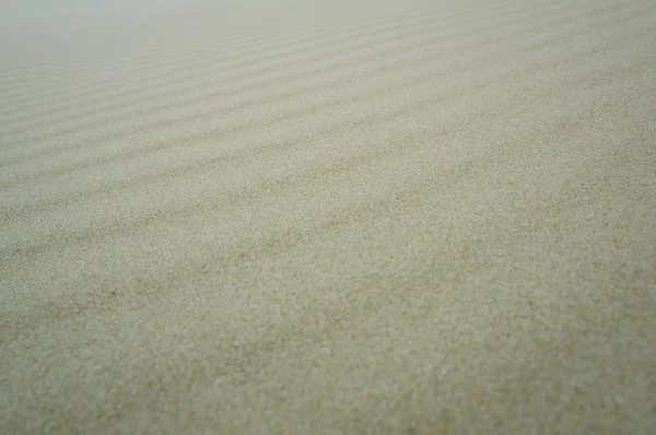 Areia fundo textura luz cor verão — Fotografia de Stock