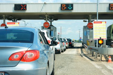 highway traffic jam on pay toll station clipart