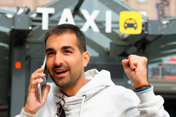 Man feeling lacky in order a taxi from his cell phone
