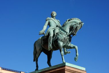 Statue of Norwegian King Karl Johan XIV in front the Royal Palac clipart