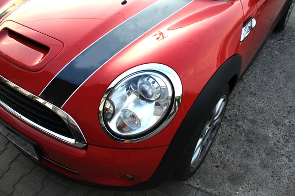 Attractive red sports car with a dark line — Stock Photo, Image