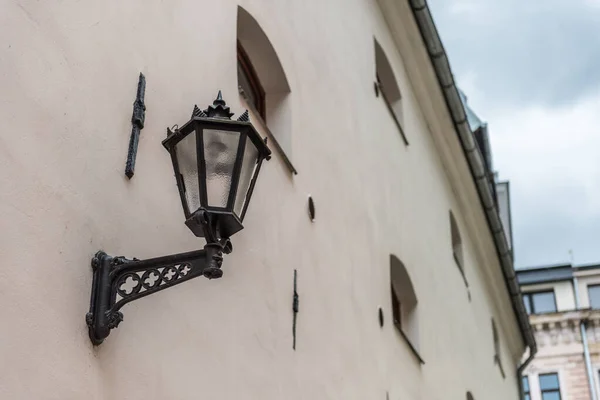 Vintage black gothic street wall lantern in old town of Riga Vecriga, Latvia — Stock Photo, Image