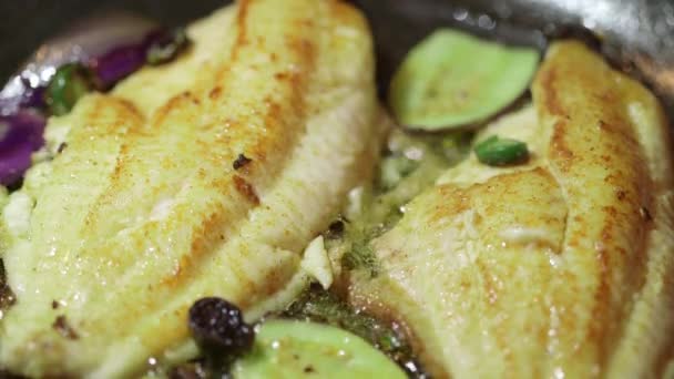 Cooking fish fillet in frying pan — Stock Video