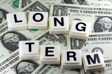 The Word long term - A Term Used in Business, Finance and Tax Concept clipart
