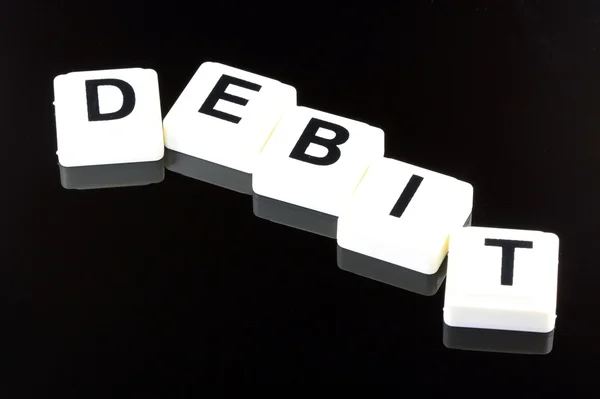 El débito de Word - Un término utilizado para negocios en finanzas y negociación bursátil —  Fotos de Stock