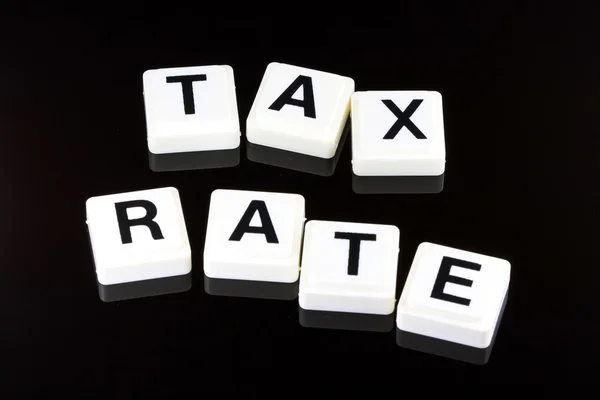 Ele Taxa de imposto Word - Um termo usado para negócios em finanças e negociação do mercado de ações — Fotografia de Stock