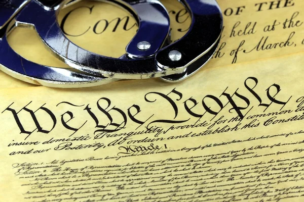 Handcuffs on constitution — Stock Photo, Image