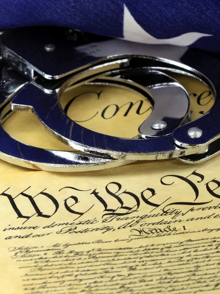 Handcuffs on constitution — Stock Photo, Image