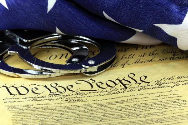 Handcuffs on constitution — Stock Photo, Image