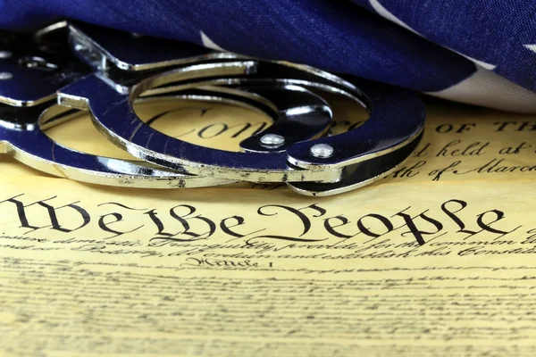 Handcuffs on constitution — Stock Photo, Image