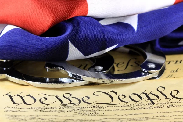 Handcuffs on constitution — Stock Photo, Image