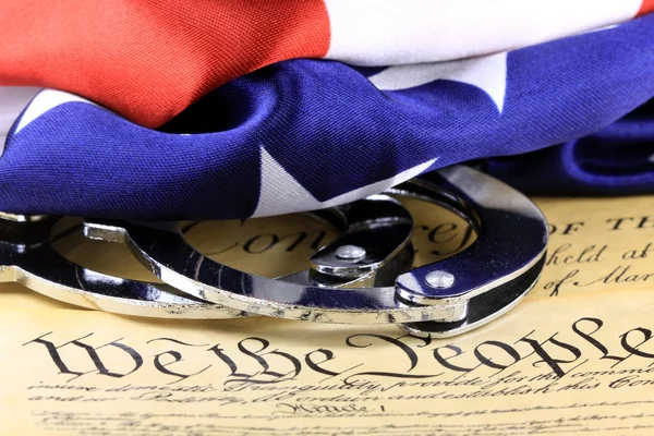 Handcuffs on constitution — Stock Photo, Image