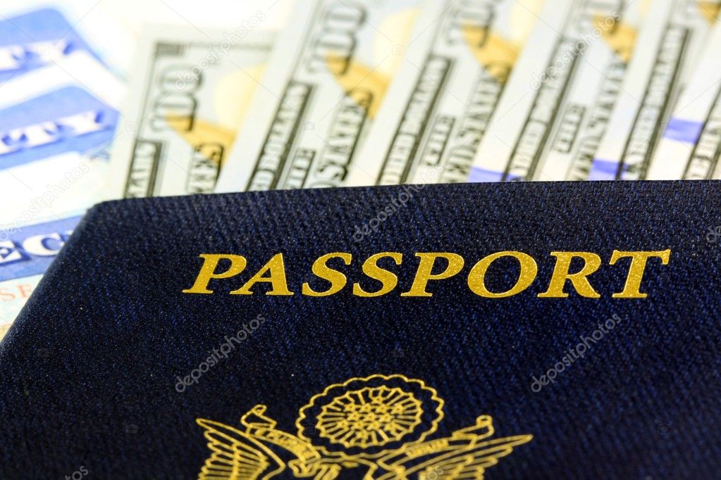 United States passport with one hundred dollar bills