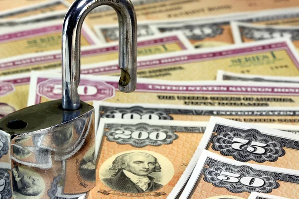 United States Savings Bonds with padlock - Financial security concept