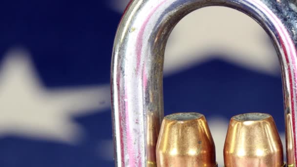 Ammunition and padlock on United States flag - Gun rights and gun control concept — Stock Video