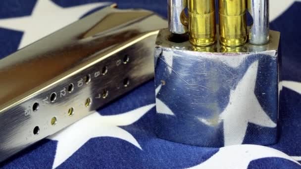 Ammunition and padlock on United States flag - Gun rights and gun control concept — Stock Video