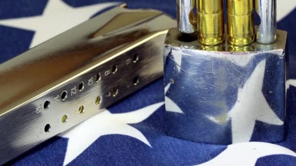 Ammunition and padlock on United States flag - Gun rights and gun control concept — Stock Video