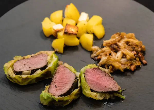 Finely seasoned lamb fillet wrapped in savoy cabbage leaves — Stock Image Finely Seasoned Lamb Fillet Wrapped Savoy Cabbage Leaves Stock Image