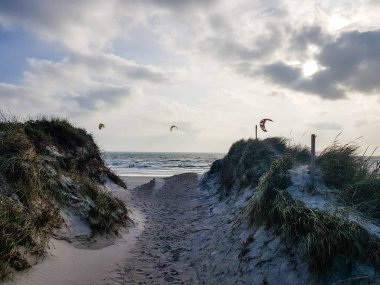 Impressions of the endless beach at the northern sea in Blavand Denmark clipart