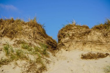 Blavand Danimarka 'nın kuzey denizindeki uçsuz bucaksız plajın izleri.