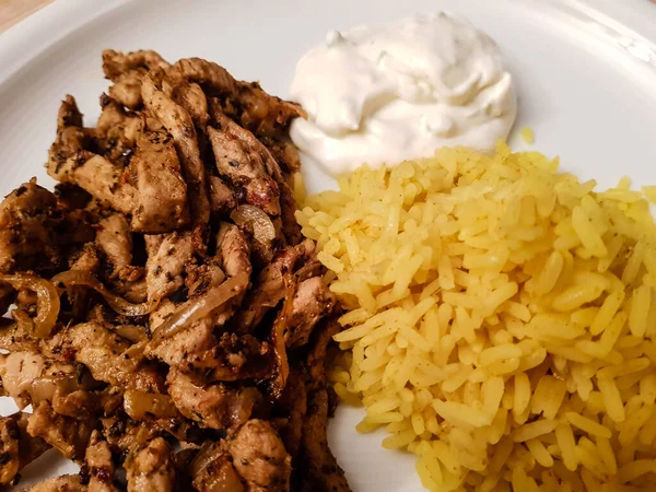 Greek Food Gyros with rice salad and bread