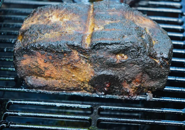 Pulled Pork of a pork shoulder roasted on a smoker