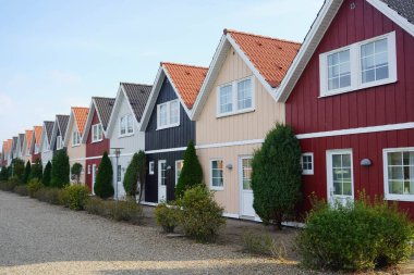 wooden townhouses as holiday homes in denmark clipart