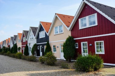 wooden townhouses as holiday homes in denmark clipart