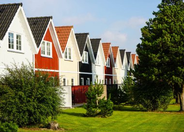 wooden townhouses as holiday homes in denmark clipart