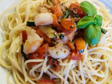 italian cuisine with basil tomatoes and pasta