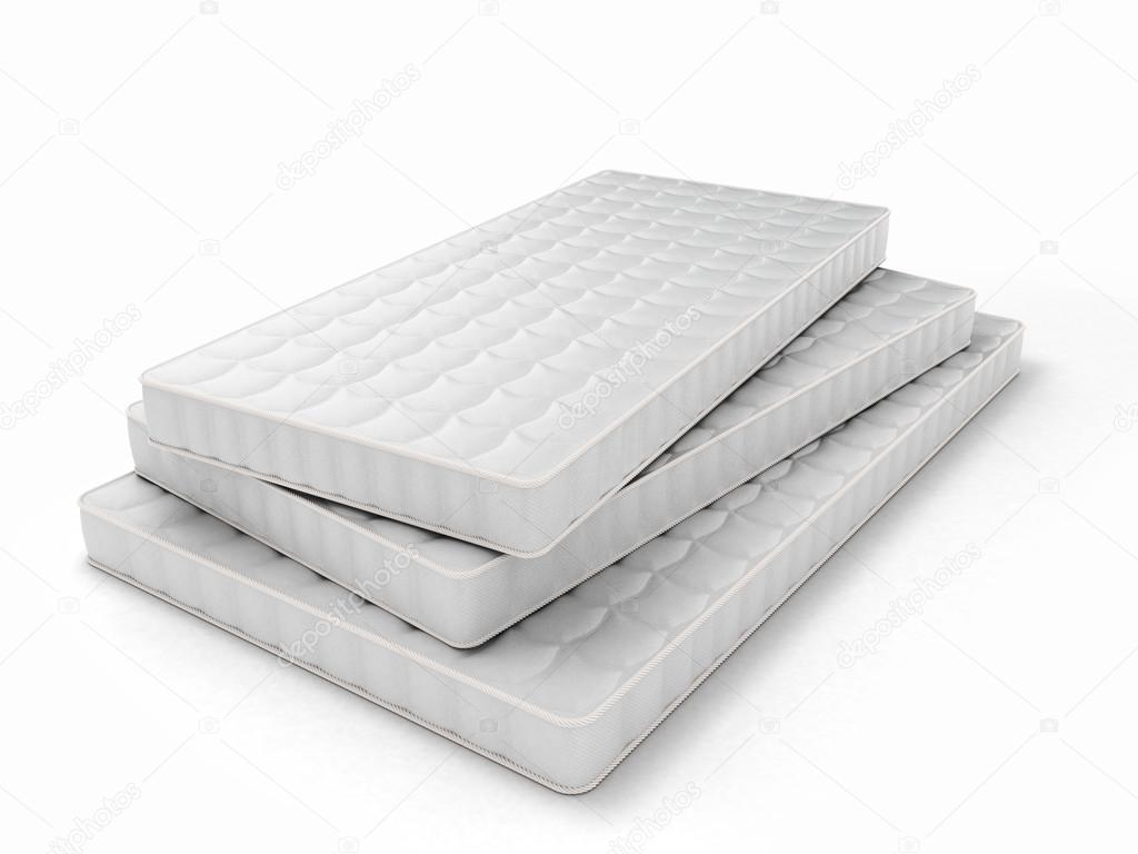 stack of mattresses of various sizes isolated on white background