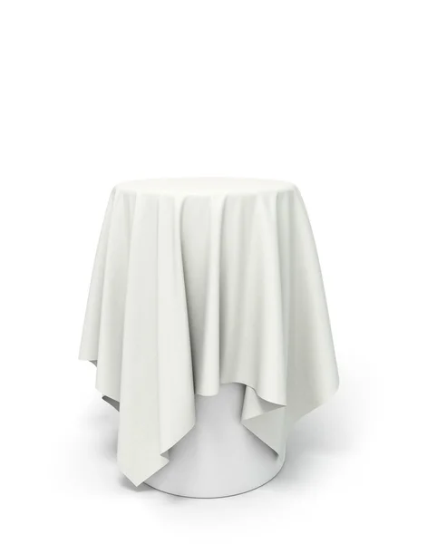 Round white tablecloth on the pedestal isolated on white — Stock Photo, Image