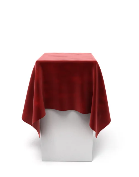 Pano de veludo vermelho em um pedestal quadrado isolado em branco — Fotografia de Stock