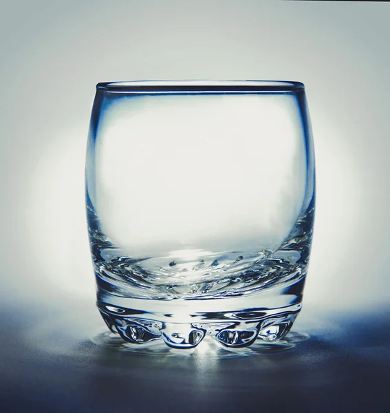 Empty glass with reflection on white background — Stock Photo, Image