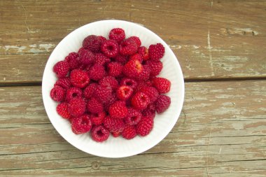 Bowl Of Freshly Picked Red Organic Raspberries