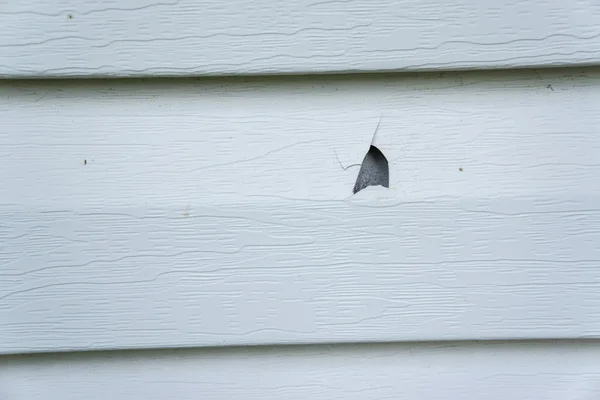 Hail Damage On Vinyl Siding Of A House — Stock Photo, Image