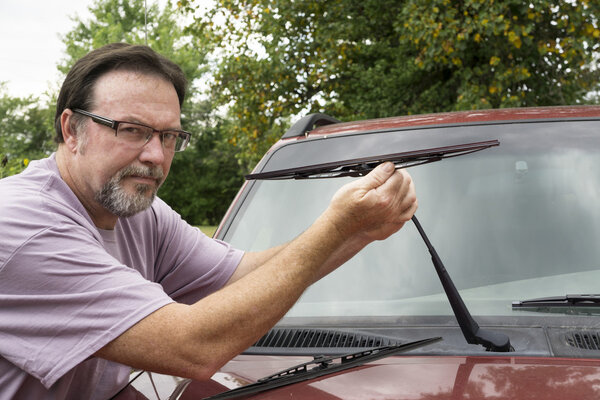 Mechanic Putting New Wiper Blade On 