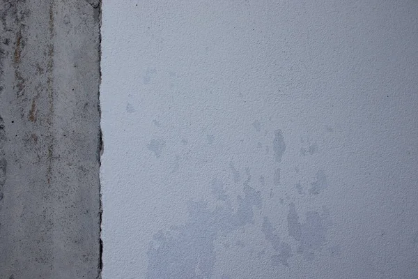 Old concrete wall with mortar cracks in both colors.