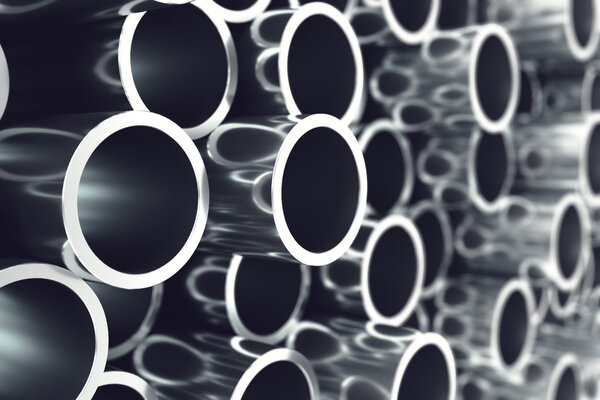 Heap of shiny metal steel pipes with selective focus effect. 3d illustration