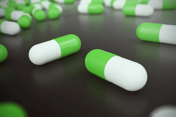 Heap of green white round capsule pills with medicine antibiotic in packages on black background. 3d illustration — Stock Photo, Image
