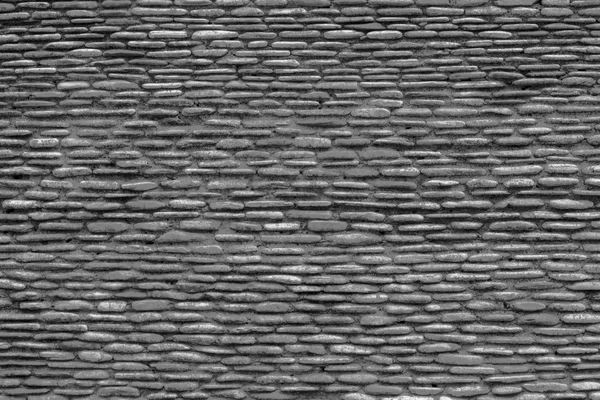 Texture sfondo del muro di pietre, in bianco e nero . — Foto Stock