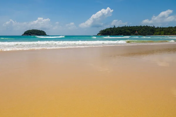 Beautiful sea Sunny landscape on the beach. Light waves of blue color spread all over the beach smoothly smoothing the Golden sand.