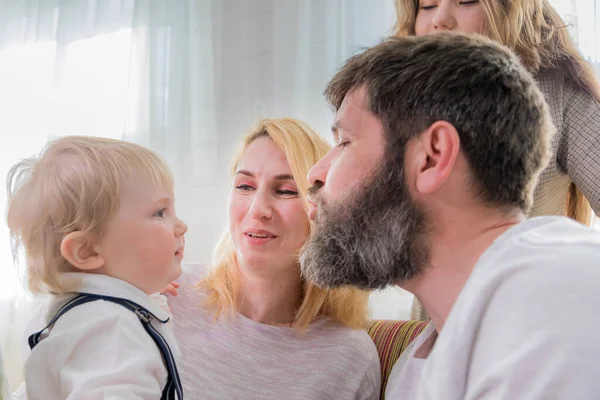 Dad with children congratulate mom on the holiday, mothers day.