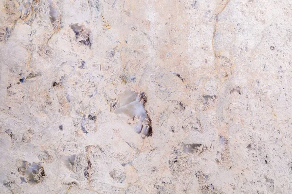 Texture pierre naturelle dolomite. Pierre avec motif beige sur une surface lisse. — Photo